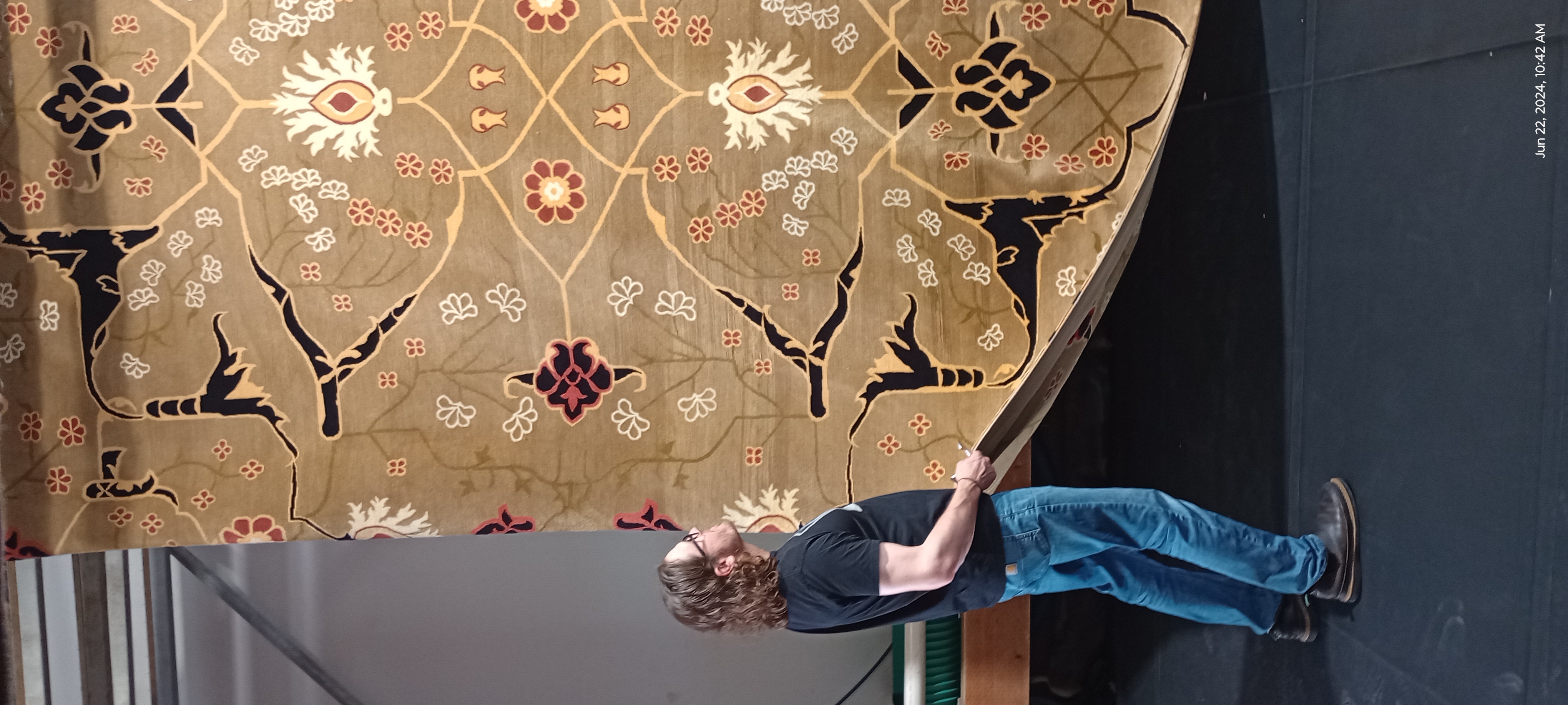 Bryan Inspecting Tibetan Rug