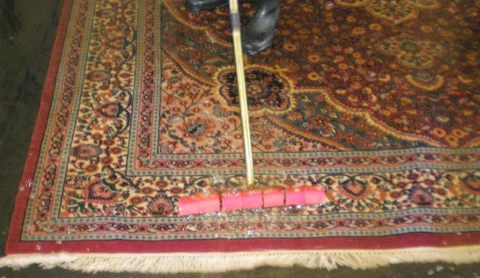 professional working on rug